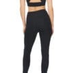 Närmare bild på en modell bakifrån som har Röhnisch Flattering High Waist Tights, Black på sig