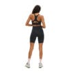 Röhnisch Flattering High Waist Bike Tights på en modell som vänder ryggen till kameran