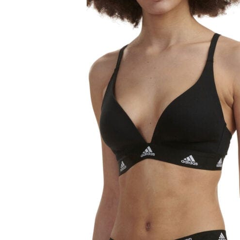 En vadderad och bekväm Adidas Padded Bralette BH (dam) från sidan på en modell