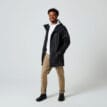 En skön och vattentät Tretorn Wings Plus Eco regnjacka (unisex) på en modell med öppen framsida